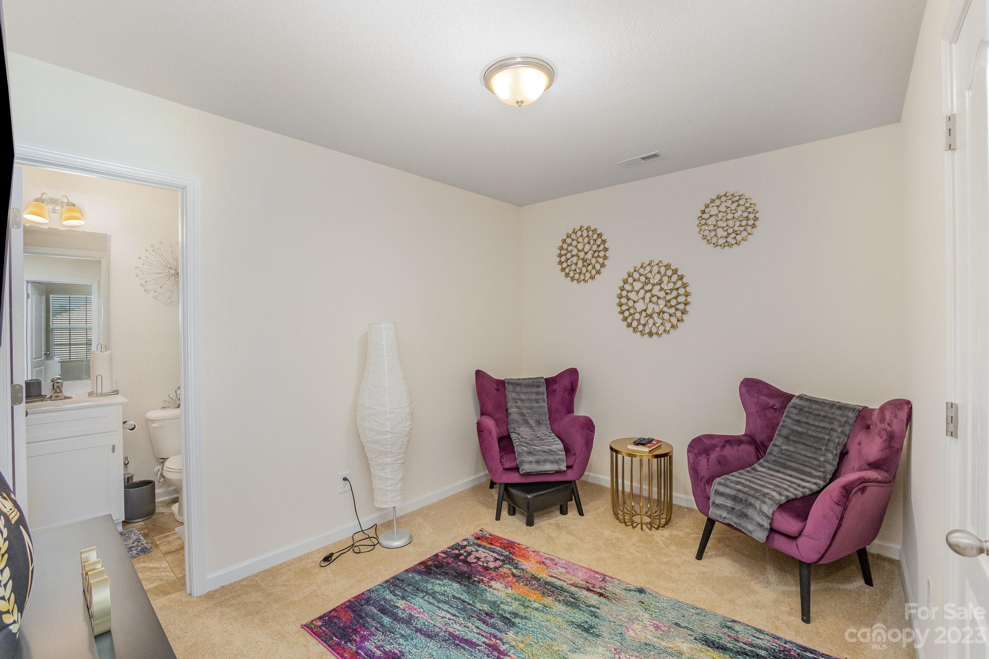 3201 Ellingford Road Charlotte, NC 28214 - Photo 21 of 29 a living room with furniture and a rug