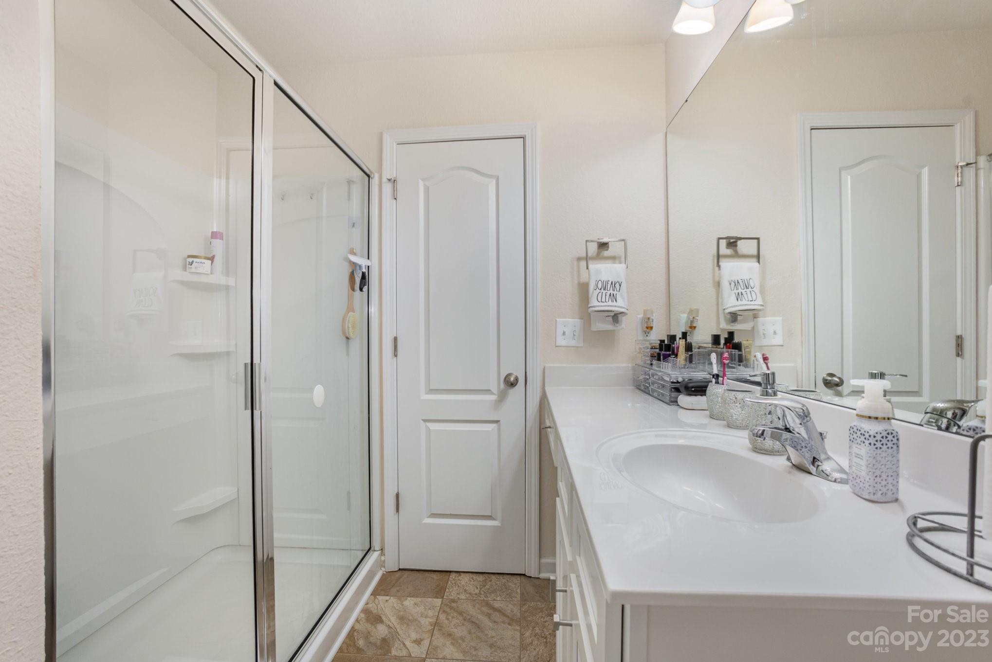 3201 Ellingford Road Charlotte, NC 28214 - Photo 22 of 29 a bathroom with a sink and a mirror