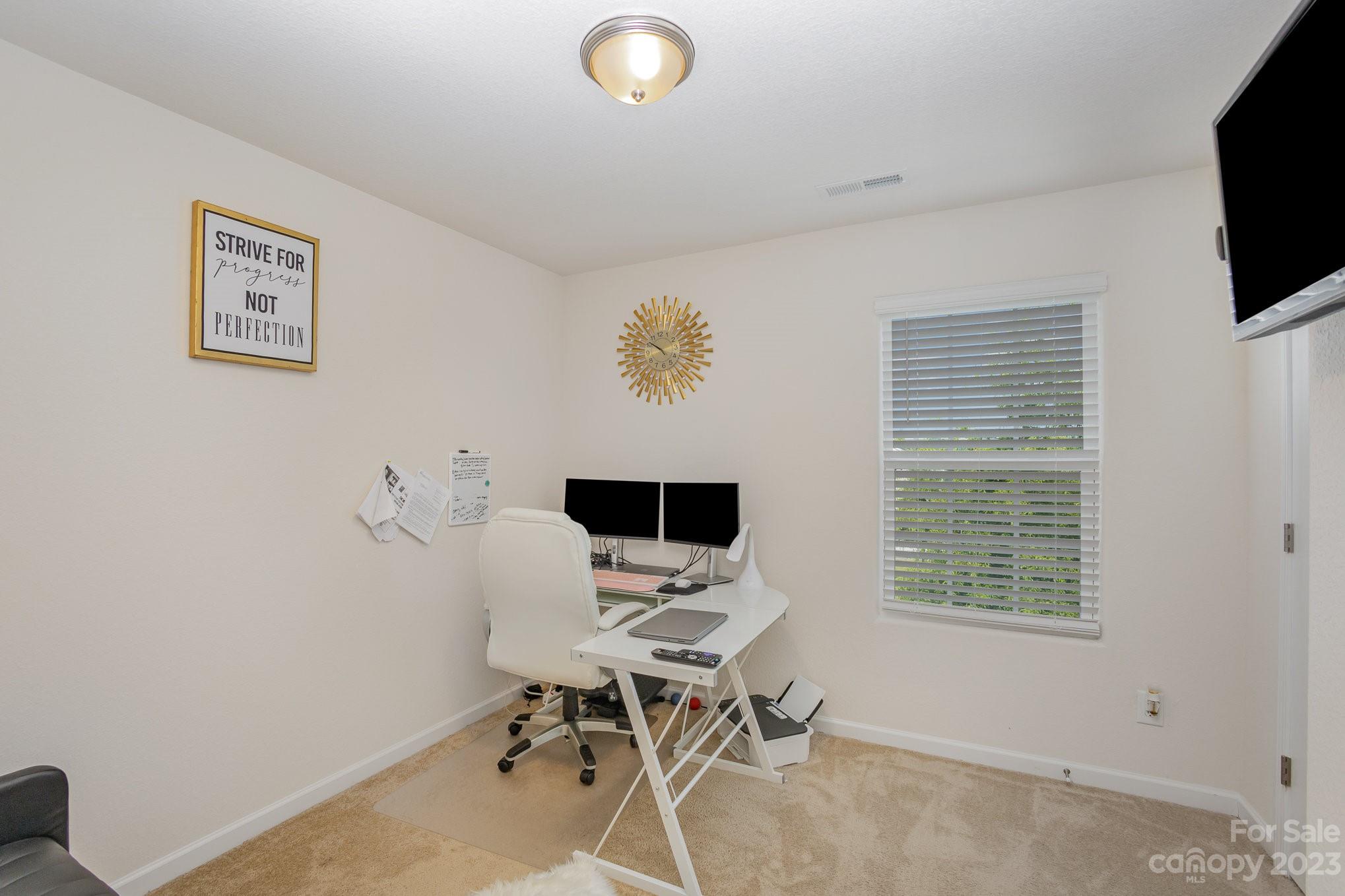3201 Ellingford Road Charlotte, NC 28214 - Photo 23 of 29 a view of a workspace with furniture and a window
