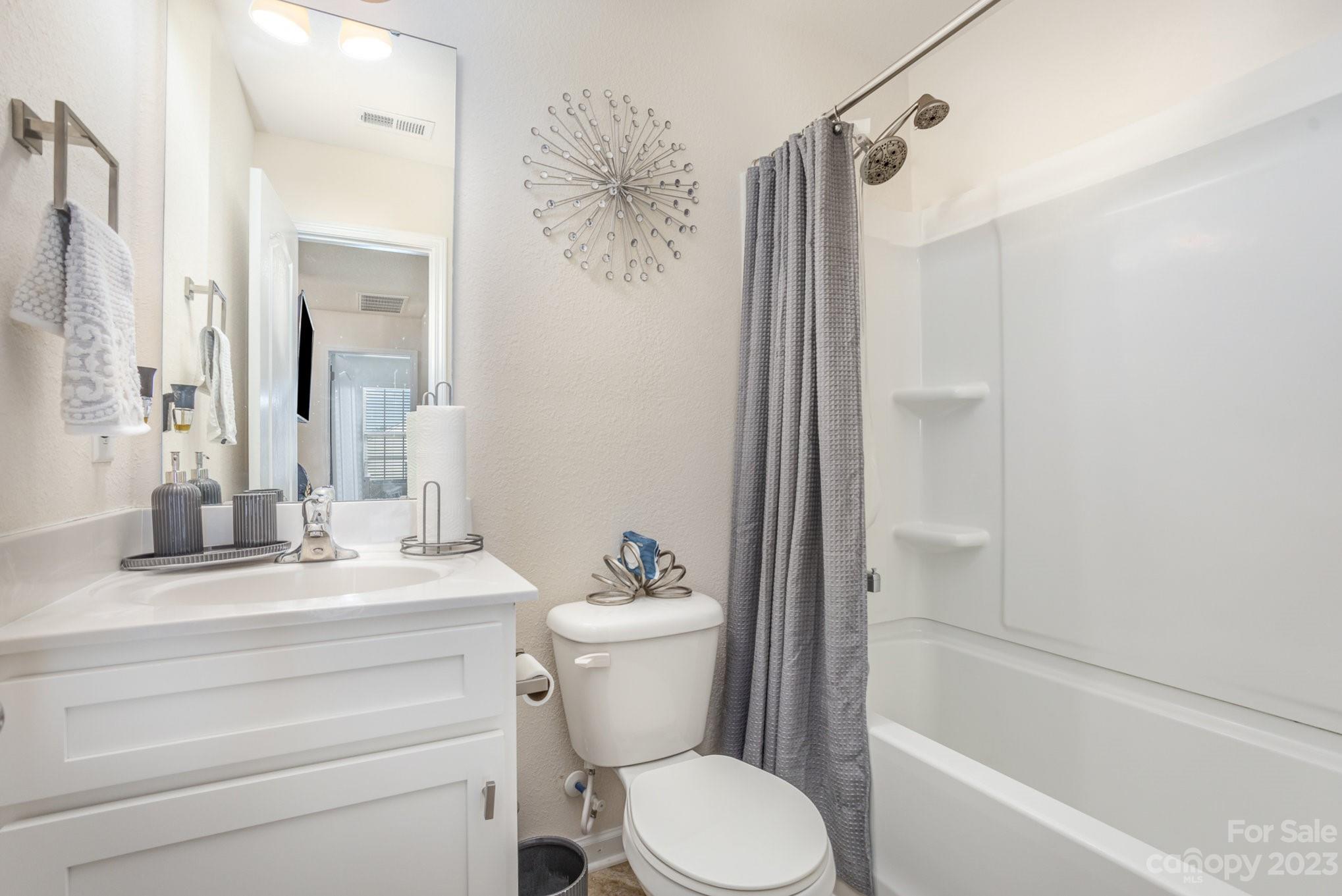 3201 Ellingford Road Charlotte, NC 28214 - Photo 25 of 29 a bathroom with a sink a toilet and shower
