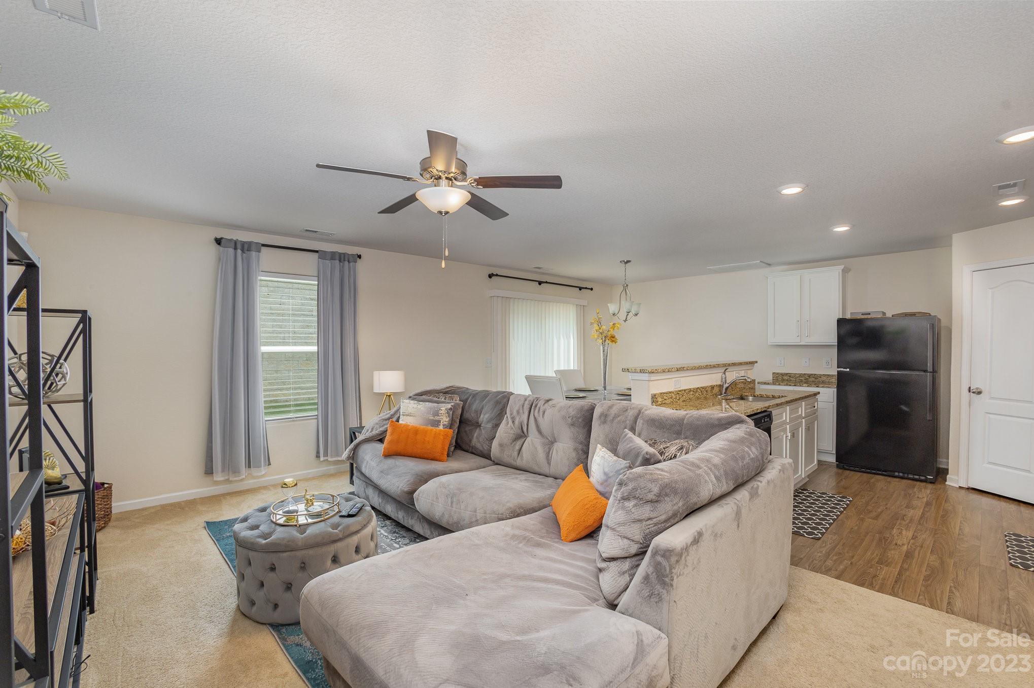 3201 Ellingford Road Charlotte, NC 28214 - Photo 6 of 29 a living room with furniture and kitchen view