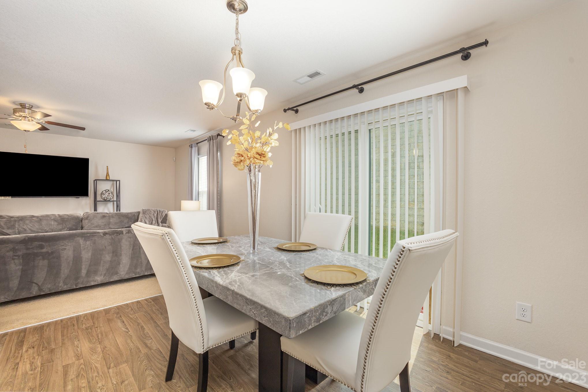 3201 Ellingford Road Charlotte, NC 28214 - Photo 10 of 29 a view of a dining room with furniture window and wooden floor