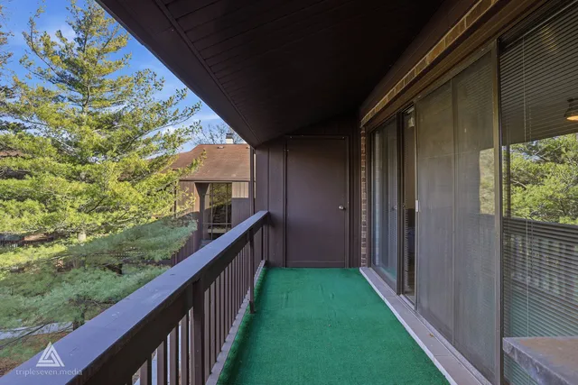 a view of a balcony with an outdoor space