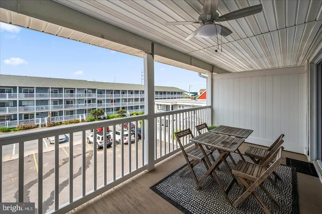 a view of a chairs and table in the balcony