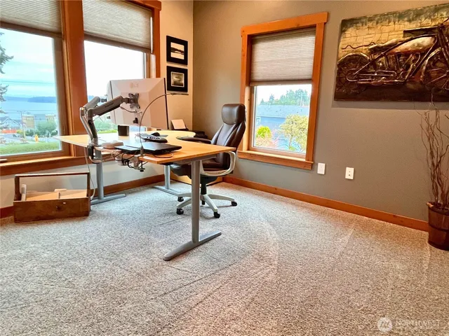 a view of a livingroom with furniture and window