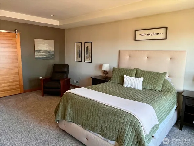 a bedroom with a bed and dresser