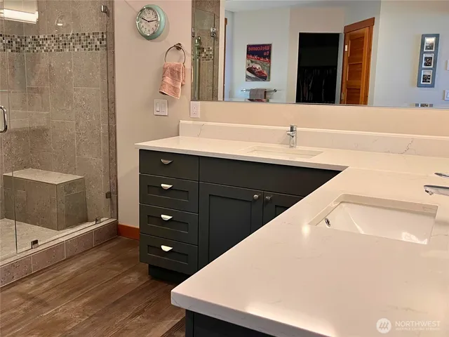 a bathroom with a sink vanity and a mirror