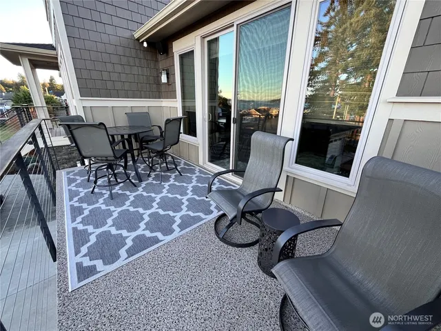 a room with gym equipment and a view of living room