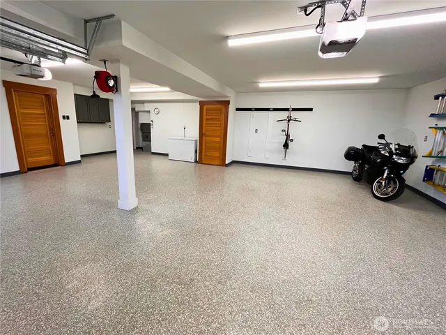 a view of a garage with parked cars