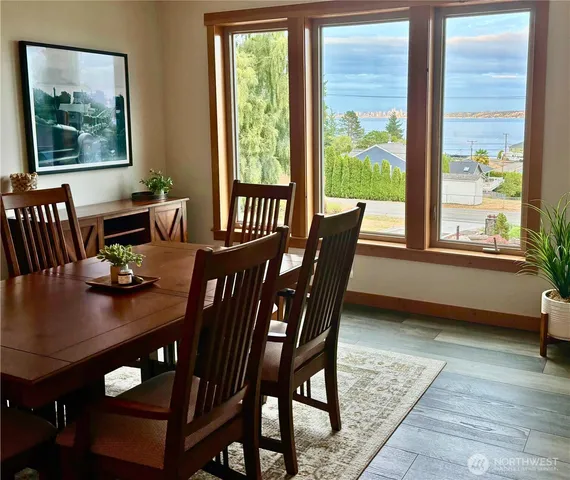 a view of a dining room with furniture window and outside view