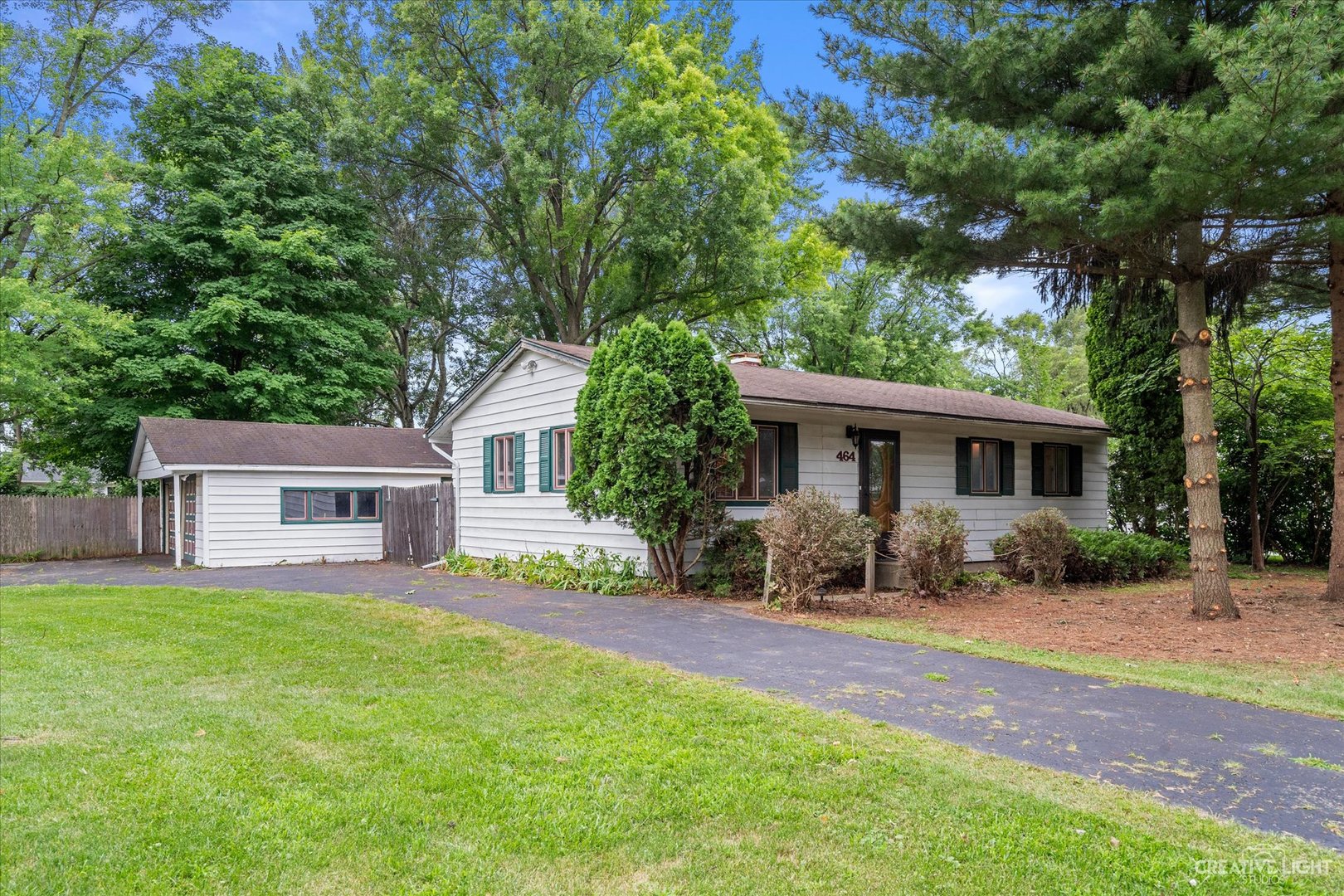 a house view with a sitting space and garden