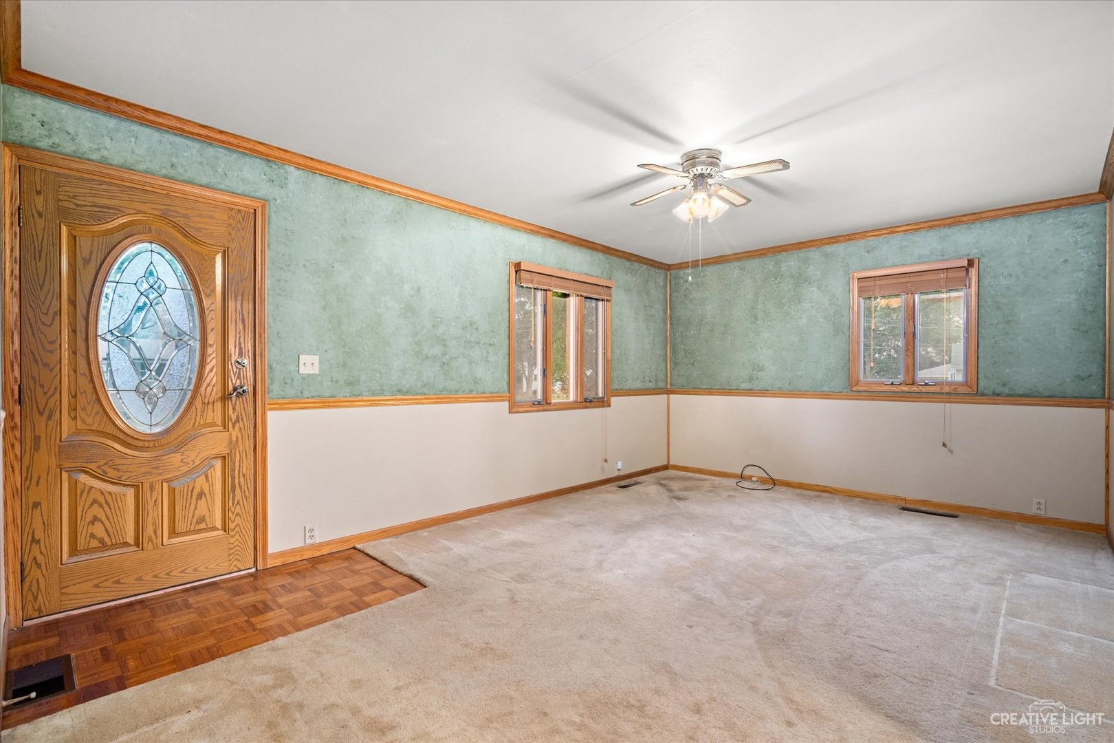 464 Davis Road Batavia, IL 60510 - Photo 12 of 17 an empty room with windows and fan