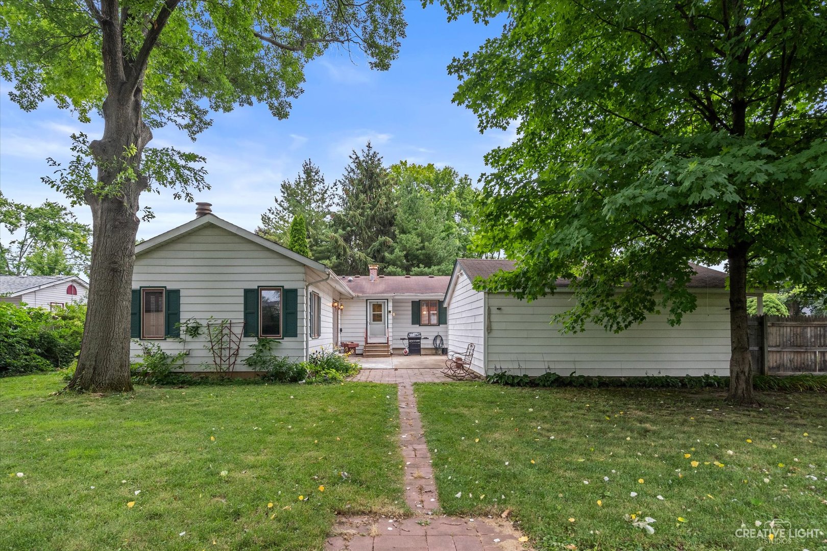 464 Davis Road Batavia, IL 60510 - Photo 17 of 17 a front view of house with a garden and patio