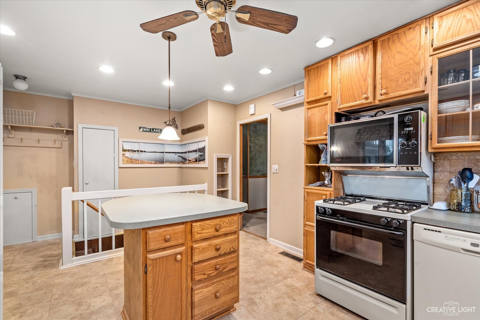 464 Davis Road Batavia, IL 60510 - Photo 7 of 17 a kitchen with stainless steel appliances kitchen island granite countertop a stove and a refrigerator