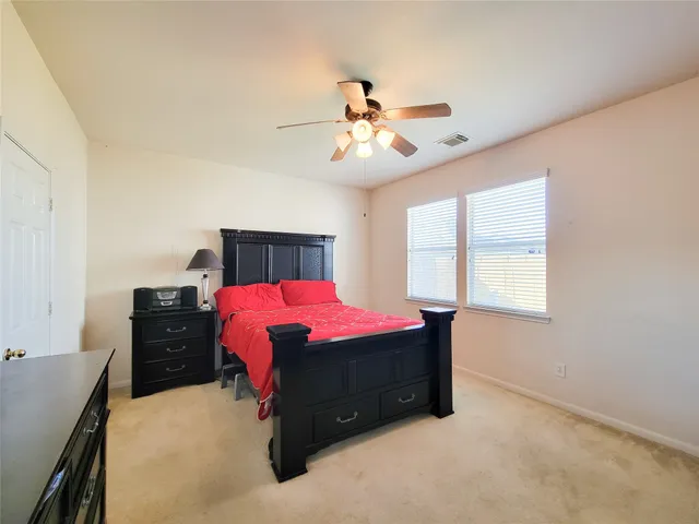 a bed room with a bed and a chandelier