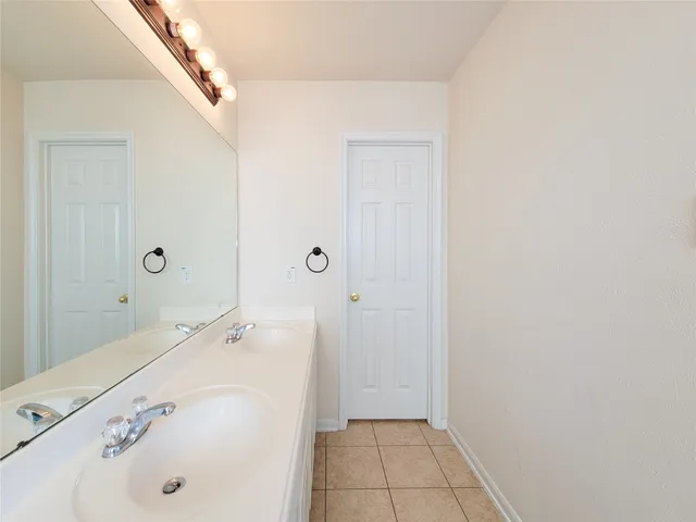 a bathroom with a bathtub and a sink
