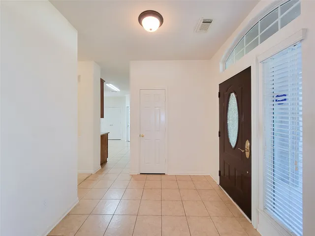 a view of a bathroom with a sink and a mirror