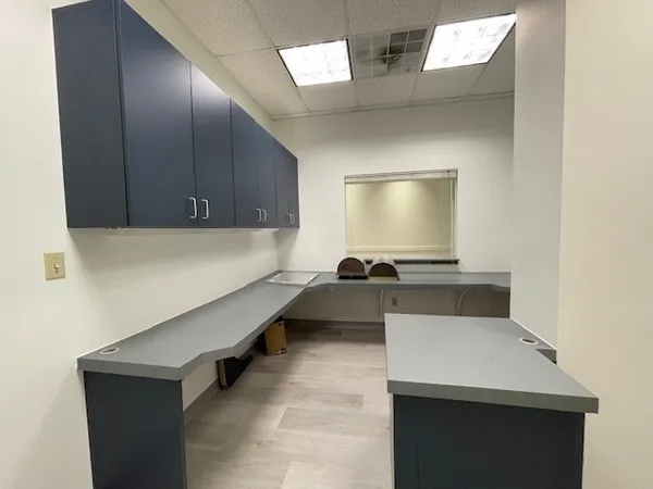 a kitchen with a sink and a refrigerator