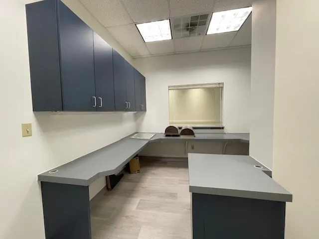 a kitchen with a sink and a refrigerator