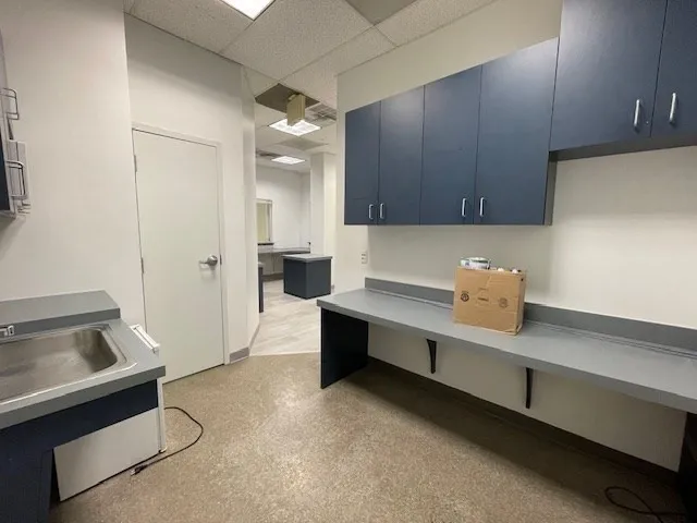 a kitchen with a sink stove and microwave