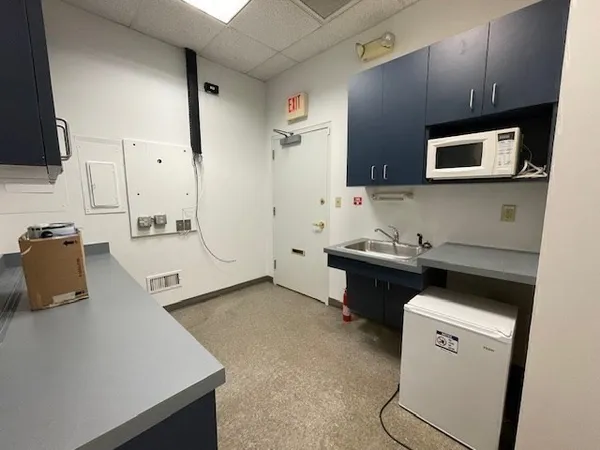 a white toilet sitting next to a bathroom sink