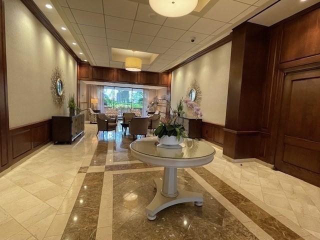 10 Hawthorne Place, Unit 106 Boston, MA 02114 - Photo 23 of 32 a room with two sinks a desk and a large window