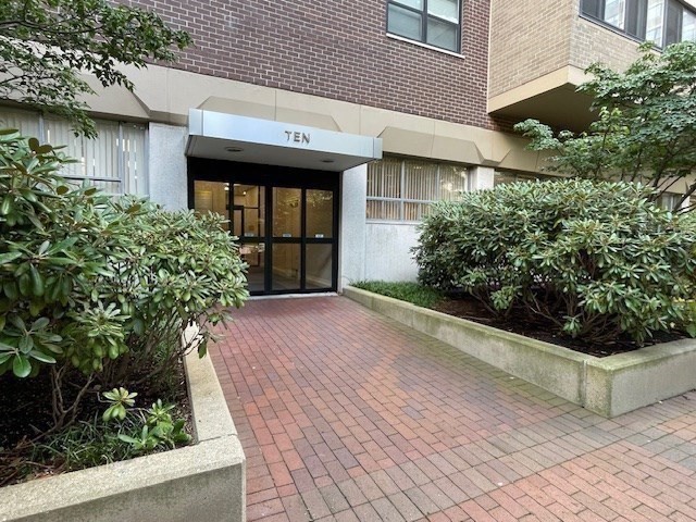 10 Hawthorne Place, Unit 106 Boston, MA 02114 - Photo 31 of 32 a front view of a house with garden