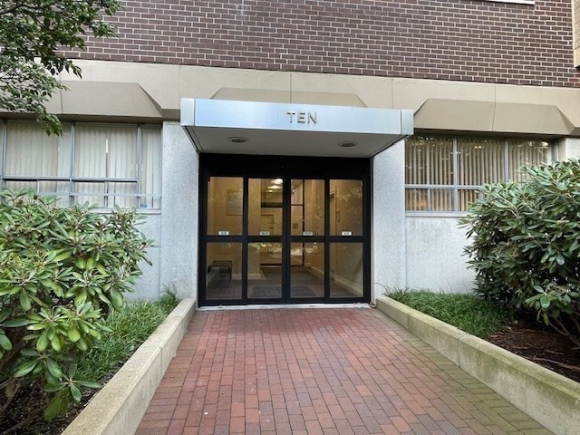 10 Hawthorne Place, Unit 106 Boston, MA 02114 - Photo 5 of 32 a view of a brick house with a large window