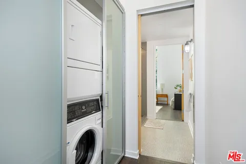 a view of a hallway with washer and dryer