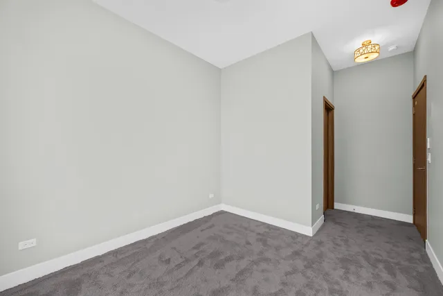 a bathroom with a toilet sink vanity tub and shower