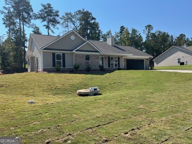 429 Riley Circle Northwest Milledgeville, GA 31061 - Photo 2 of 8 a front view of a house with a garden