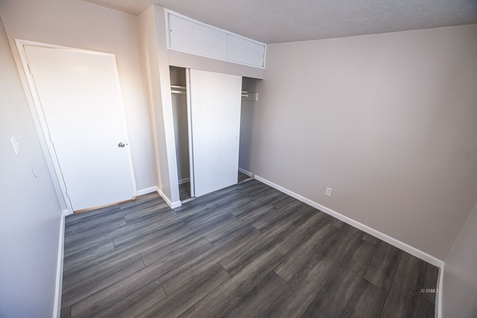 1525 South Porter Ridgecrest, CA 93555 - Photo 12 of 29 a view of an empty room with wooden floor and closet