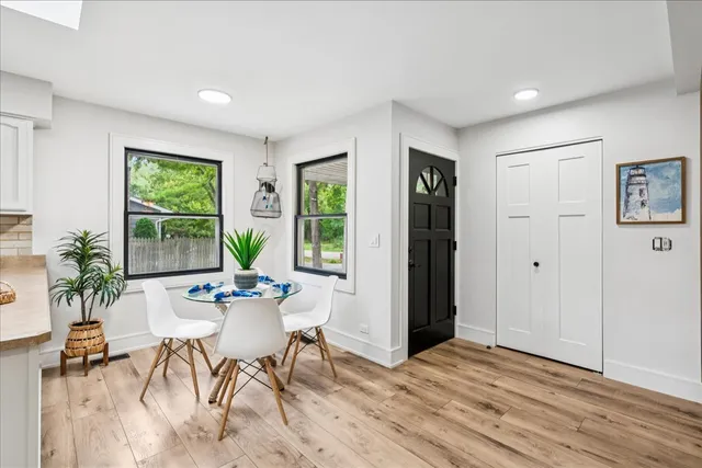 a view of a livingroom with furniture window and wooden floor