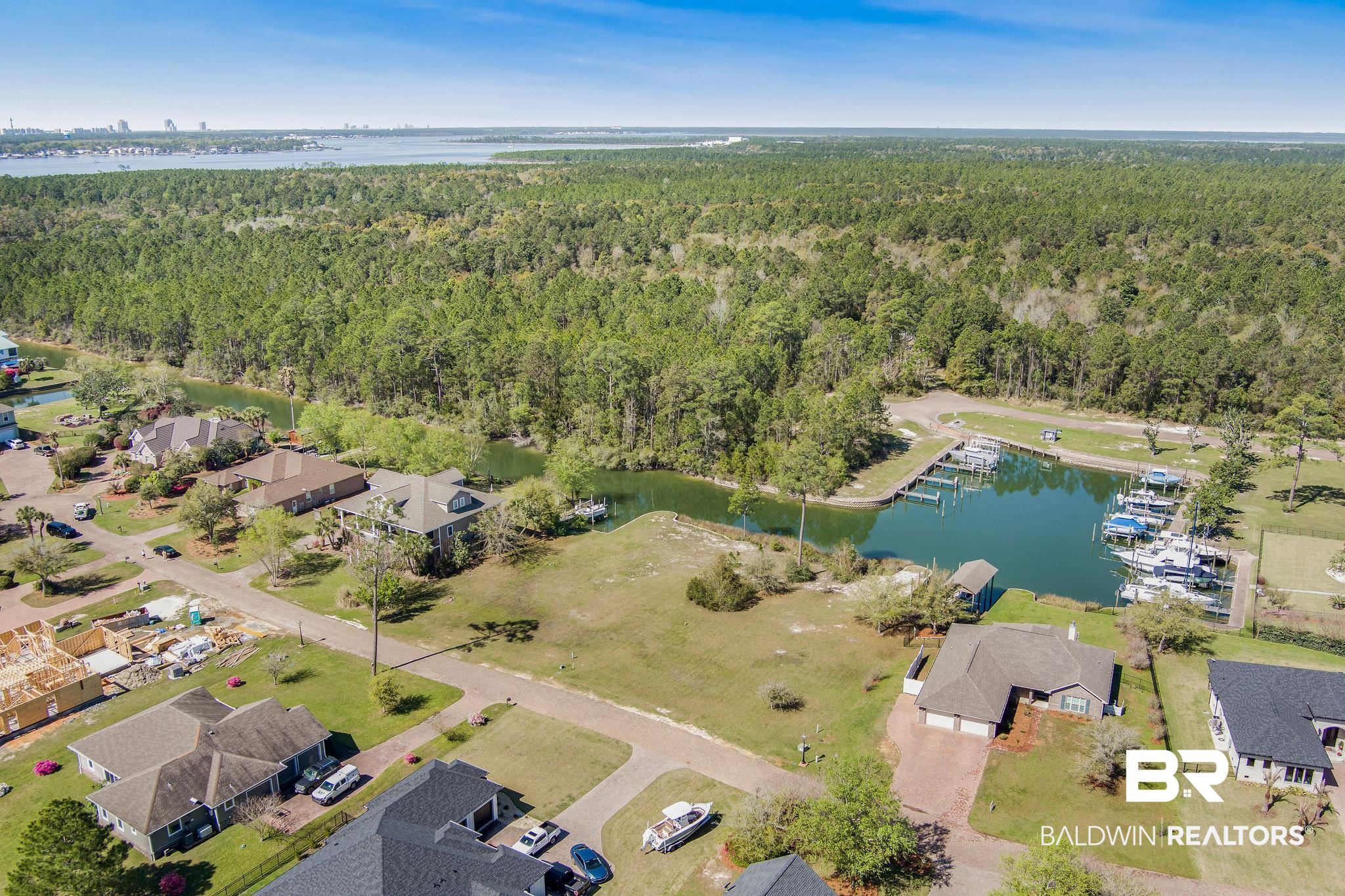 6433 East Quarry Drive Elberta, AL 36530 - Photo 5 of 10 Aerial view featuring a water view, a residential view, and a forest view