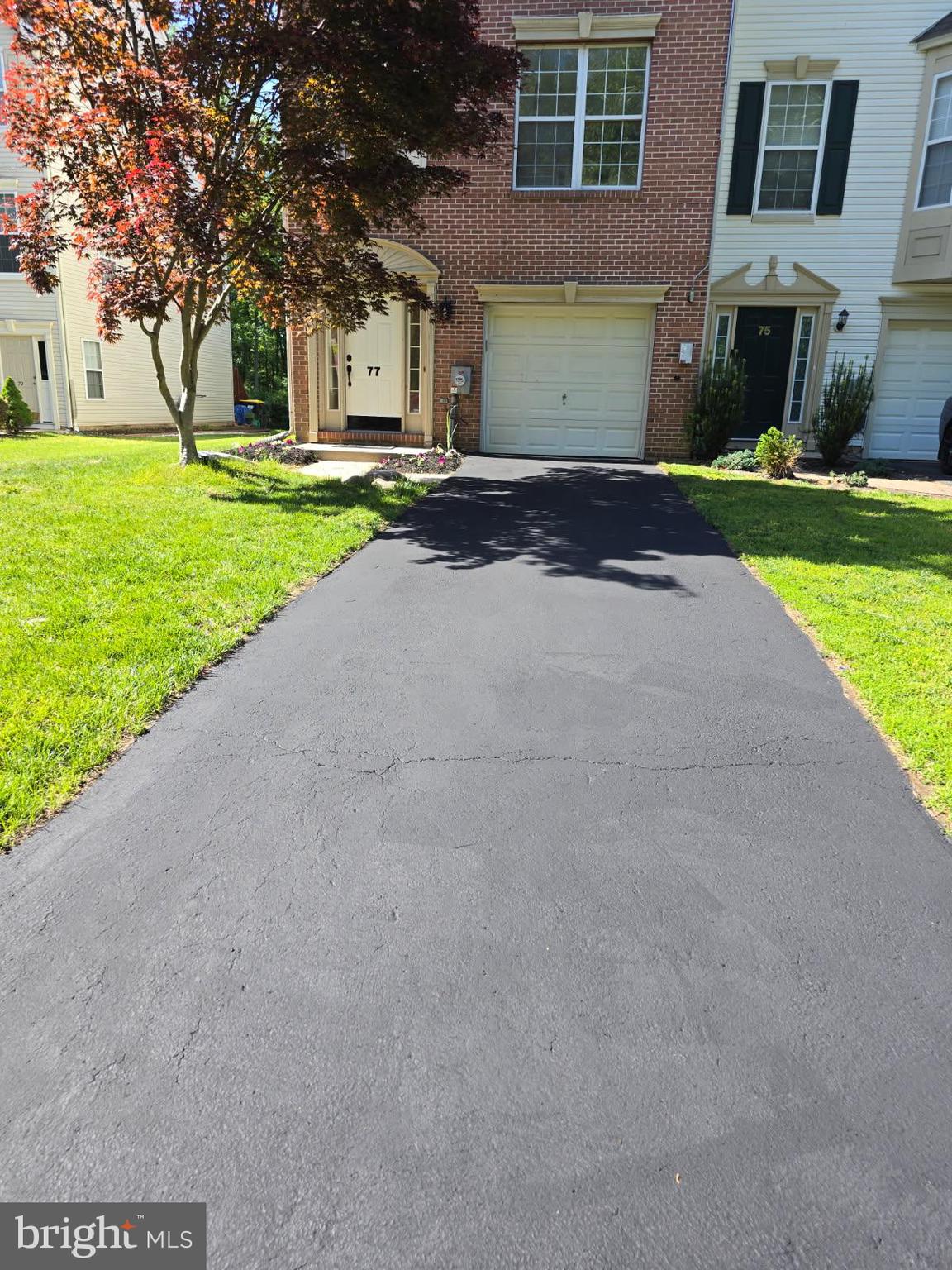 77 Wicklow Road Bear, DE 19701 - Photo 11 of 54 a front view of a house with a yard and garage