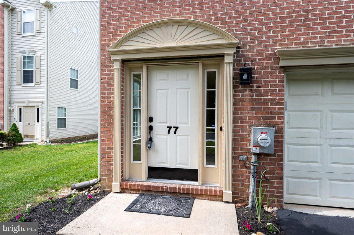 77 Wicklow Road Bear, DE 19701 - Photo 13 of 54 a view of a brick house with a large door