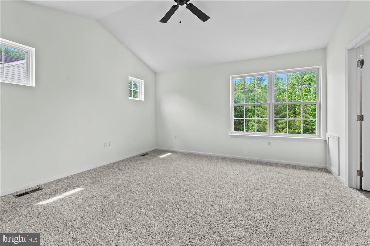 77 Wicklow Road Bear, DE 19701 - Photo 29 of 54 an empty room with ceiling fan and window
