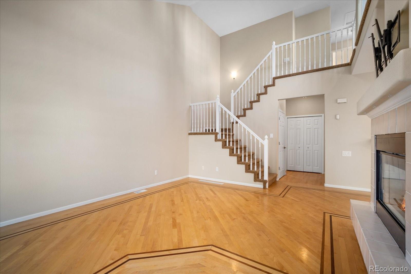 6115 Trailhead Road Highlands Ranch, CO 80130 - Photo 14 of 40 a view of a hallway with staircase