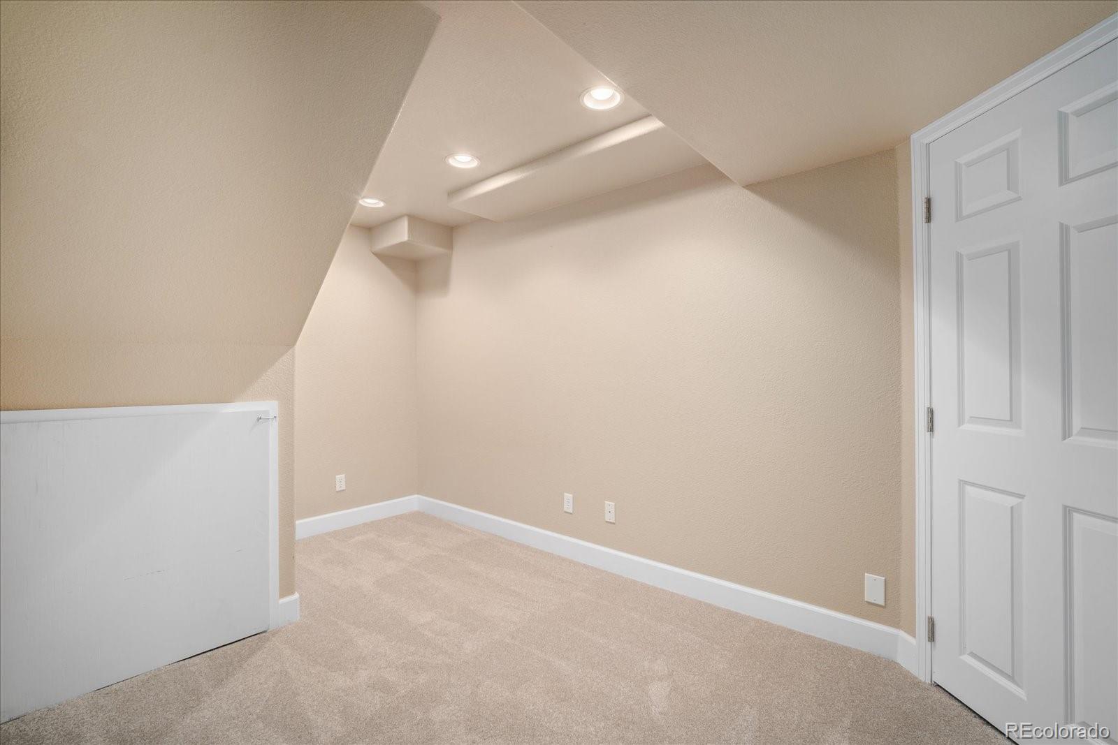 6115 Trailhead Road Highlands Ranch, CO 80130 - Photo 32 of 40 an empty room with an entryway