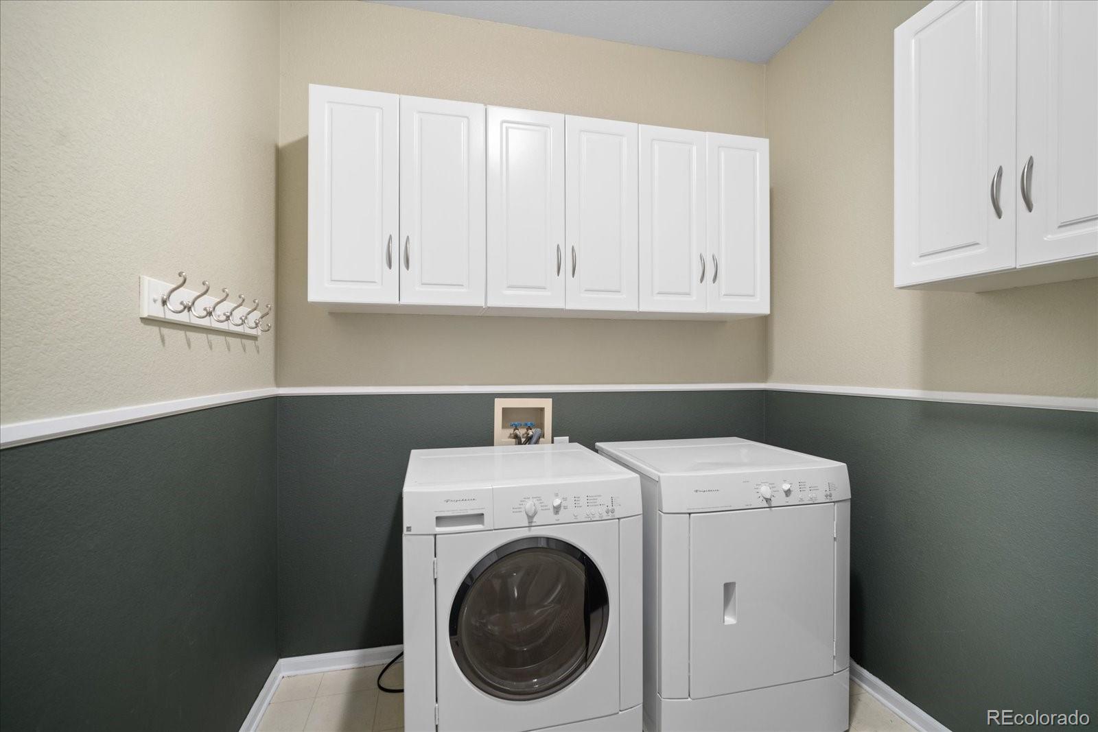 6115 Trailhead Road Highlands Ranch, CO 80130 - Photo 35 of 40 a utility room with dryer and washer