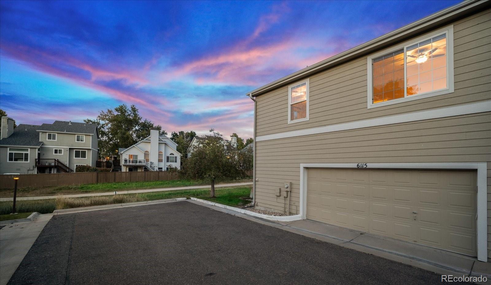 6115 Trailhead Road Highlands Ranch, CO 80130 - Photo 36 of 40 a view of a house with a street