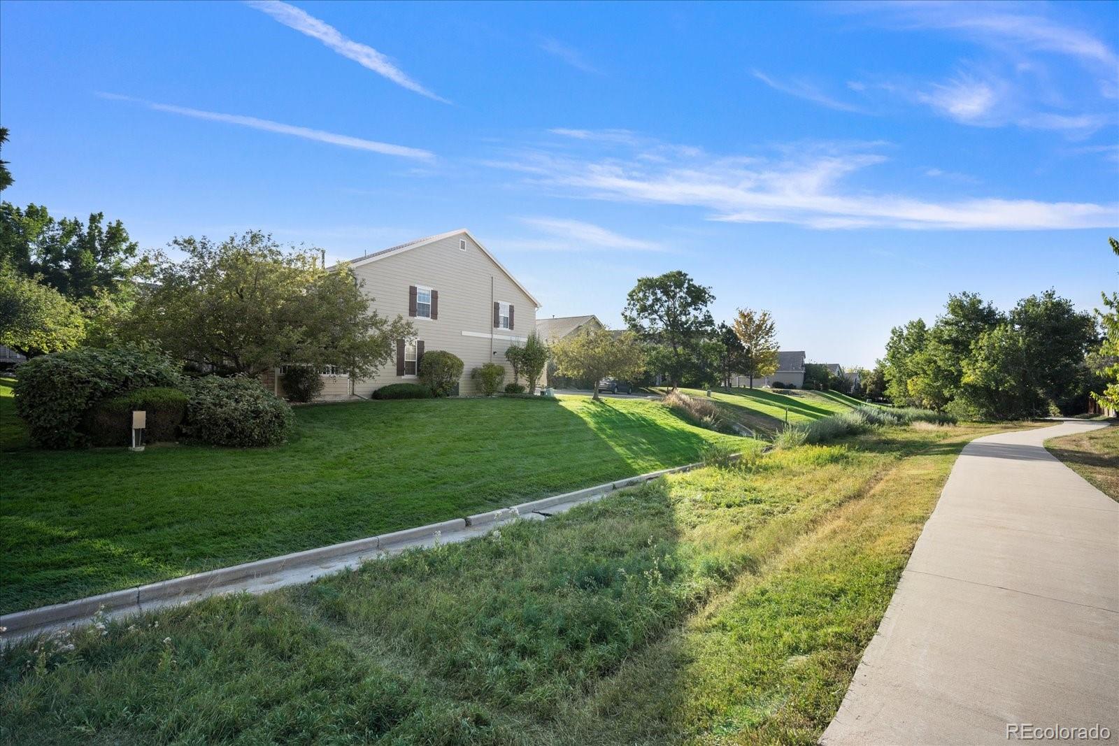 6115 Trailhead Road Highlands Ranch, CO 80130 - Photo 38 of 40 a view of a house with a big yard