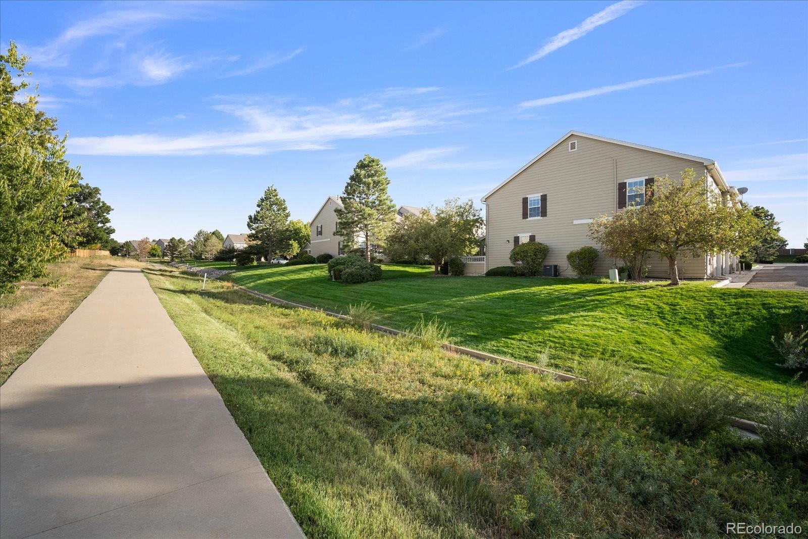 6115 Trailhead Road Highlands Ranch, CO 80130 - Photo 39 of 40 a view of a house with a yard