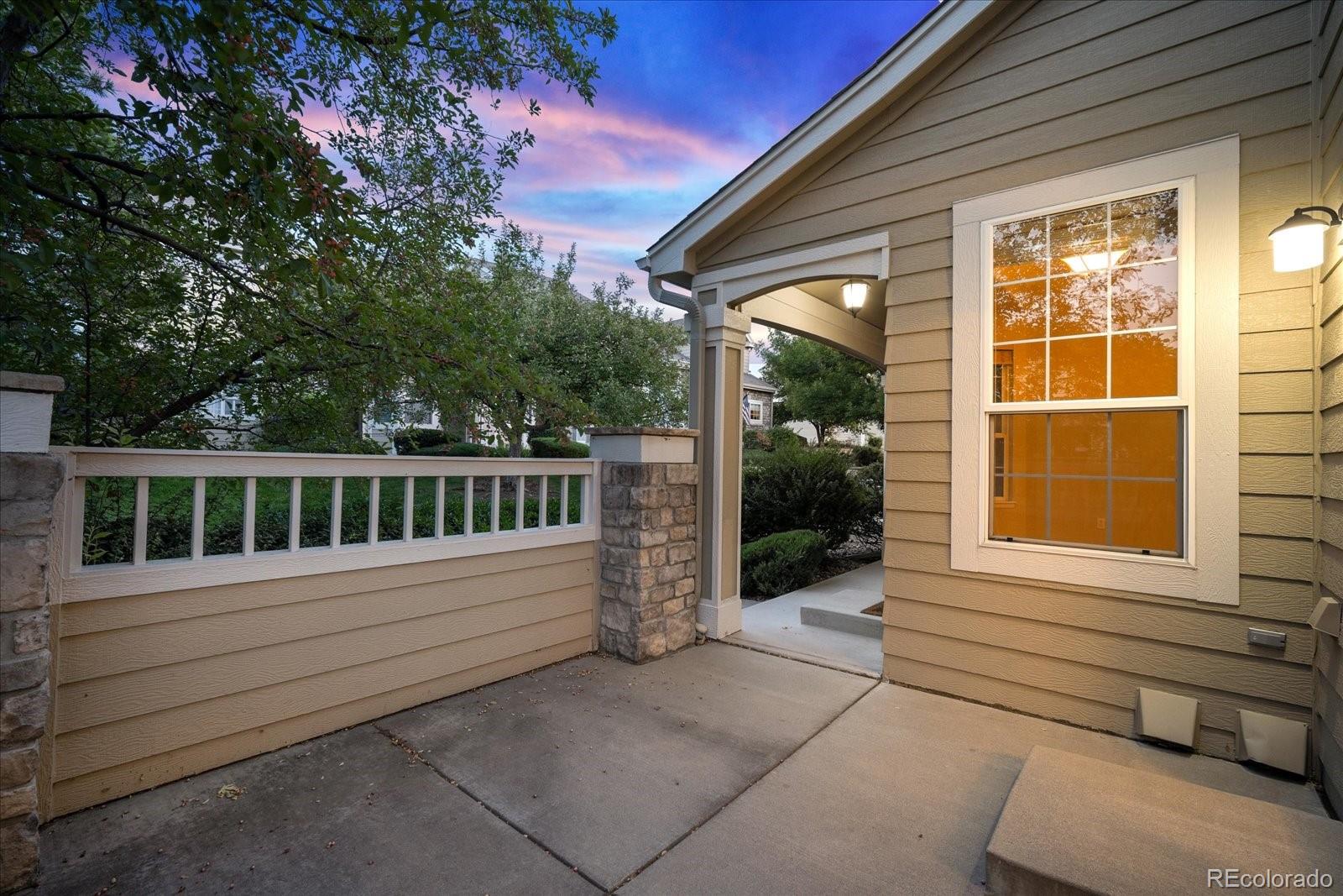 6115 Trailhead Road Highlands Ranch, CO 80130 - Photo 6 of 40 a view of a wooden bench in front of a house