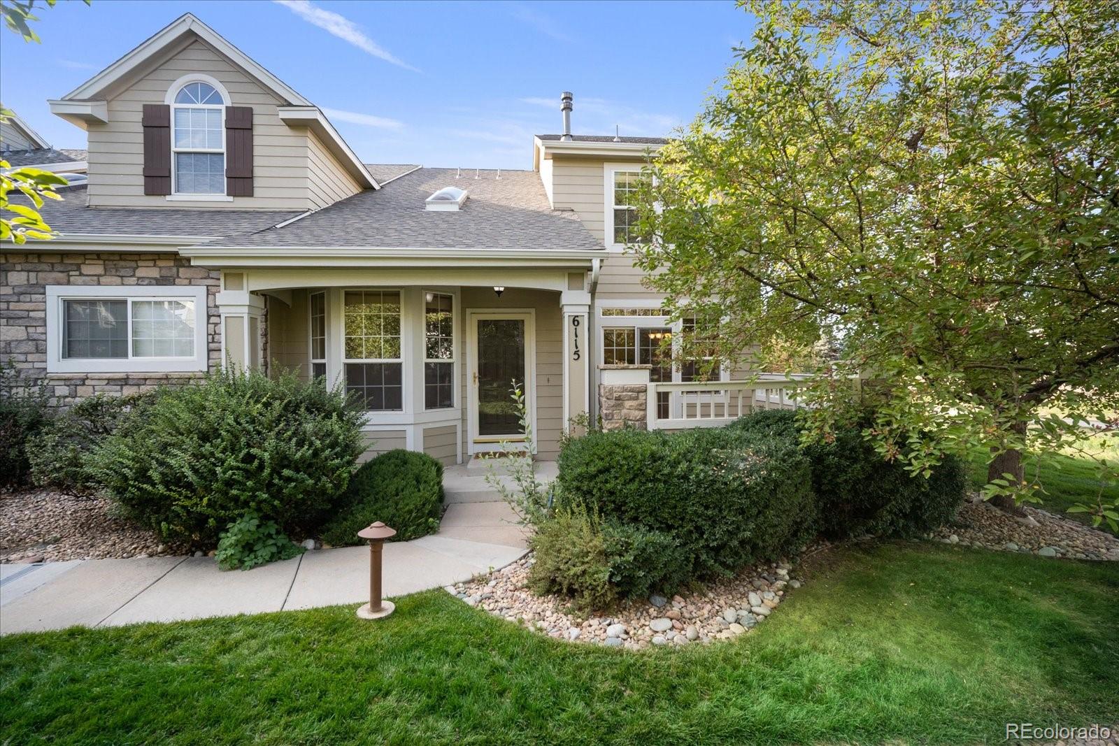 6115 Trailhead Road Highlands Ranch, CO 80130 - Photo 7 of 40 a front view of a house with a yard