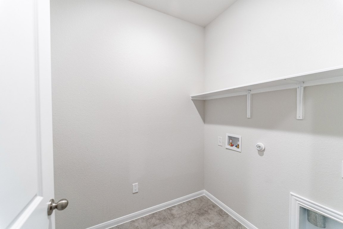 282 Denali Drive Kyle, TX 78640 - Photo 13 of 17 a view of small space with racks on the wall