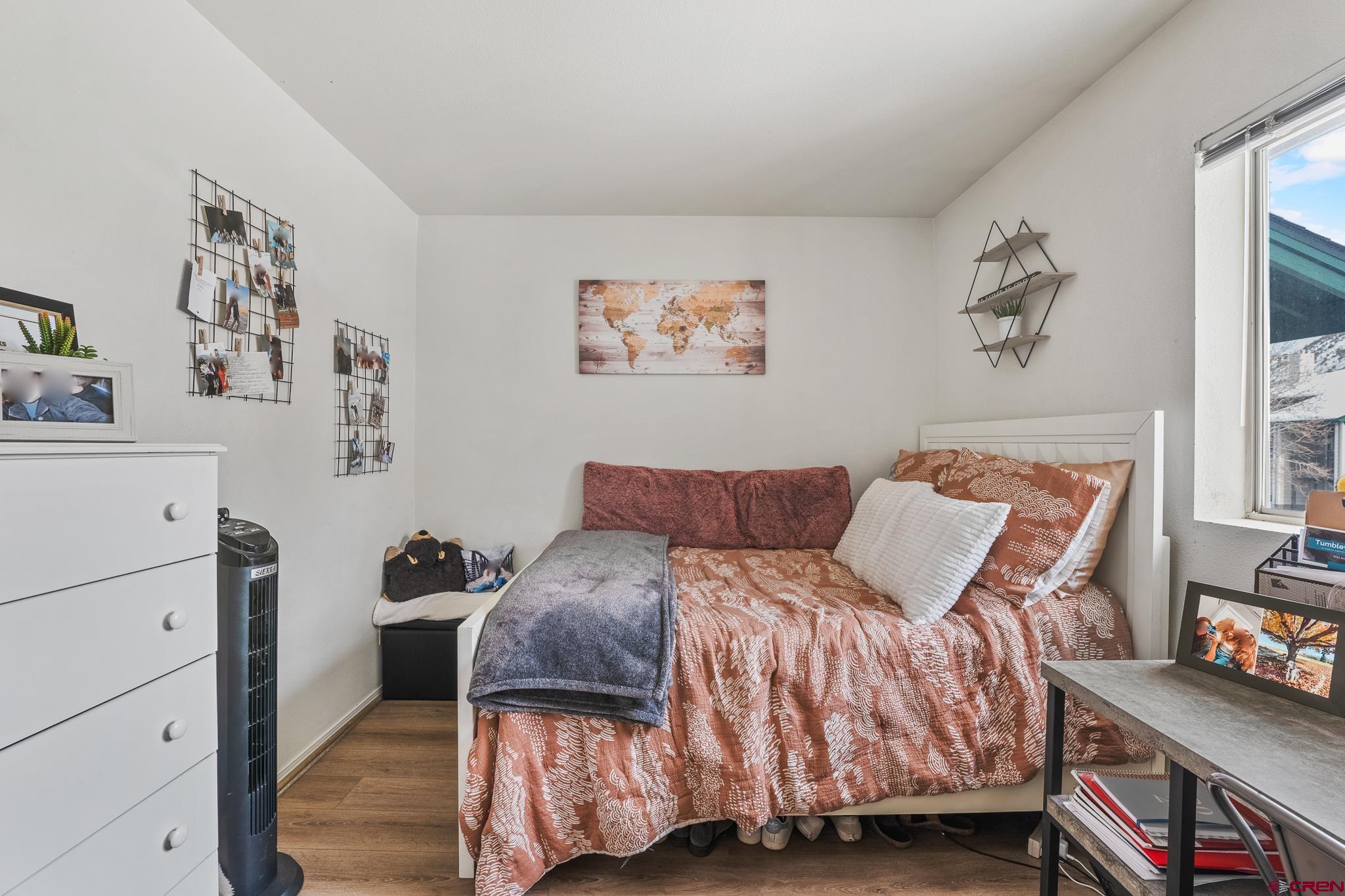 1100 Goeglein Gulch Road, Unit 206 Durango, CO 81301 - Photo 17 of 29 a bedroom with a bed and a dresser