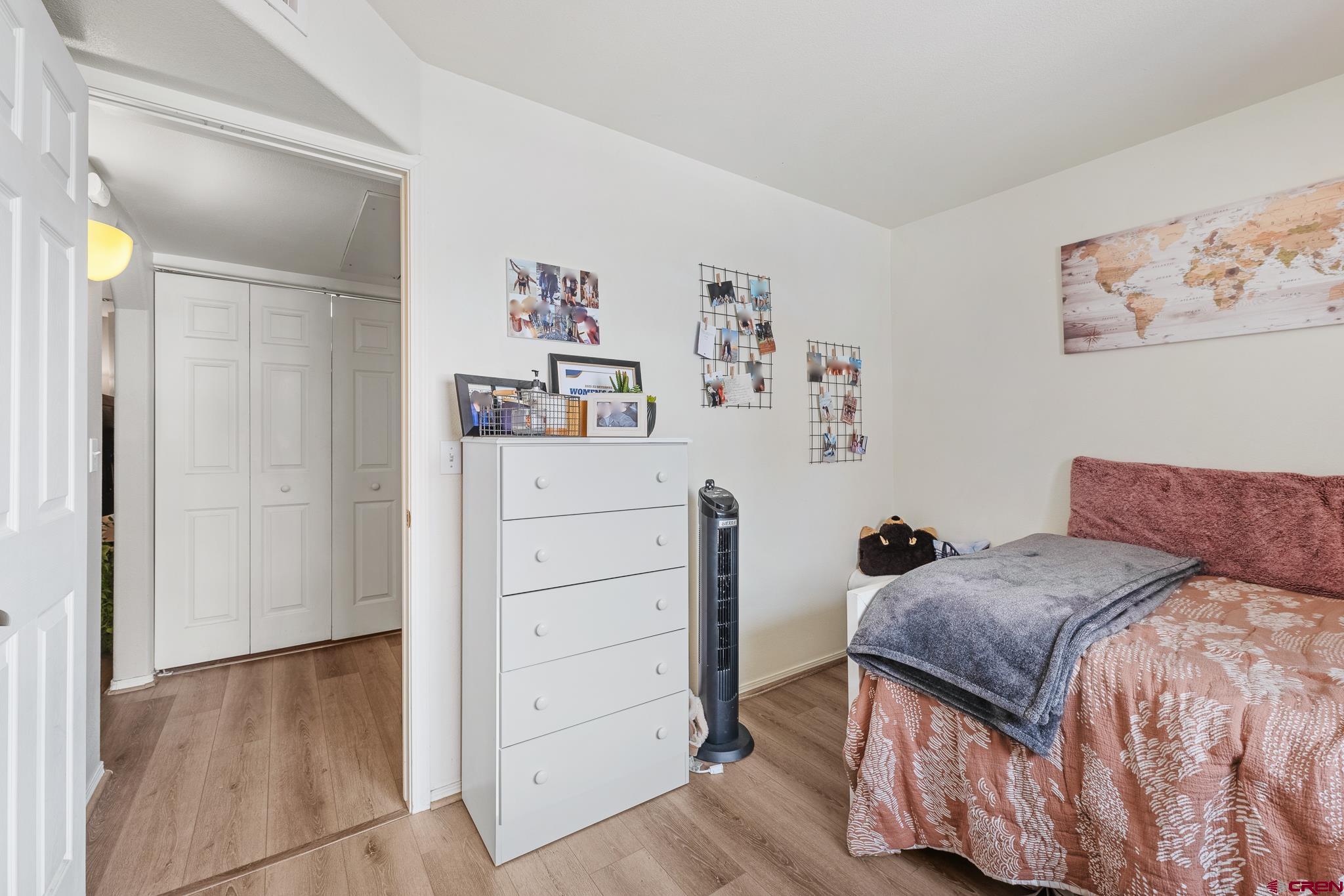 1100 Goeglein Gulch Road, Unit 206 Durango, CO 81301 - Photo 20 of 29 a bedroom with a bed and cabinets