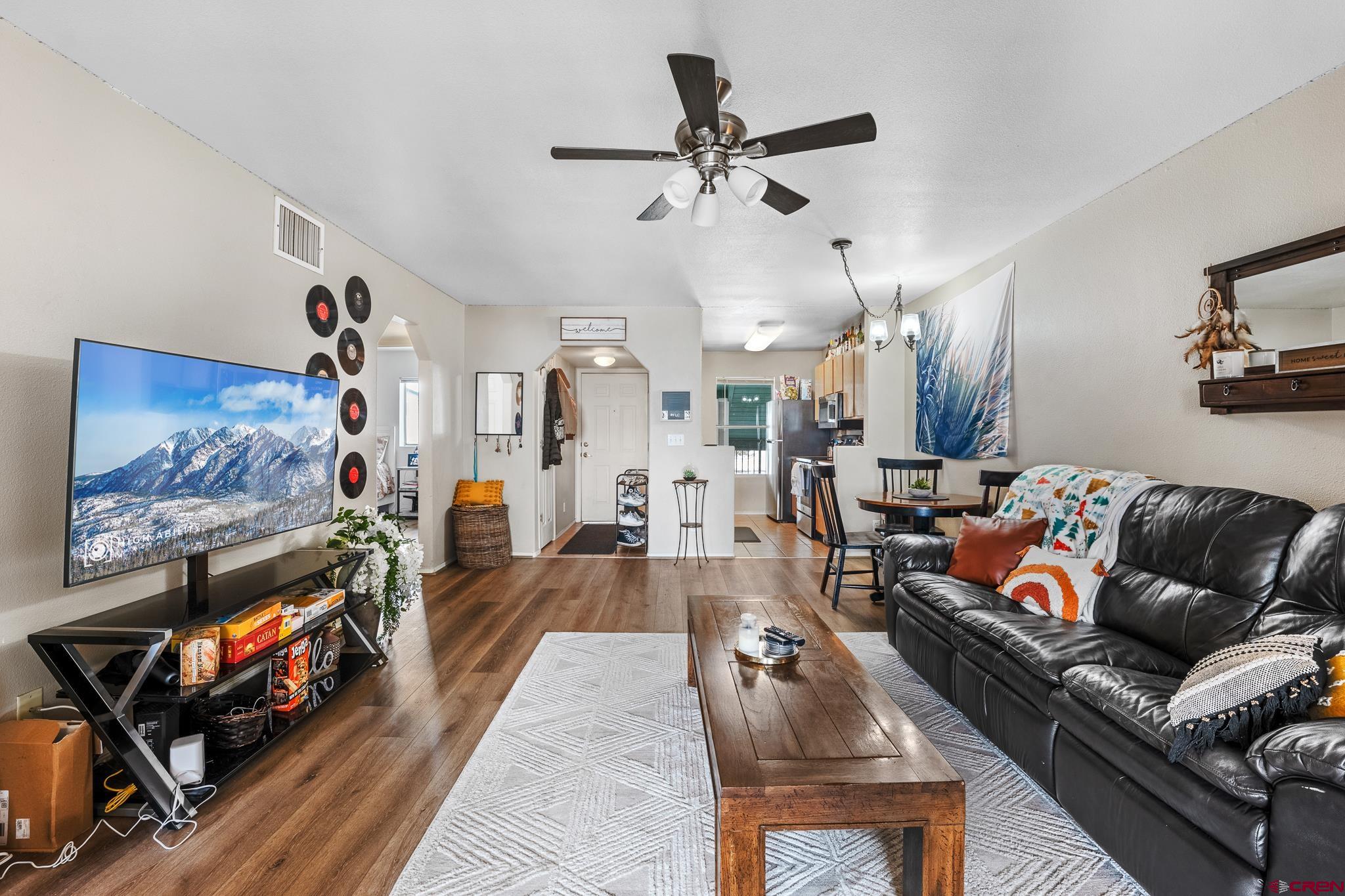 1100 Goeglein Gulch Road, Unit 206 Durango, CO 81301 - Photo 5 of 29 a living room with furniture and a flat screen tv
