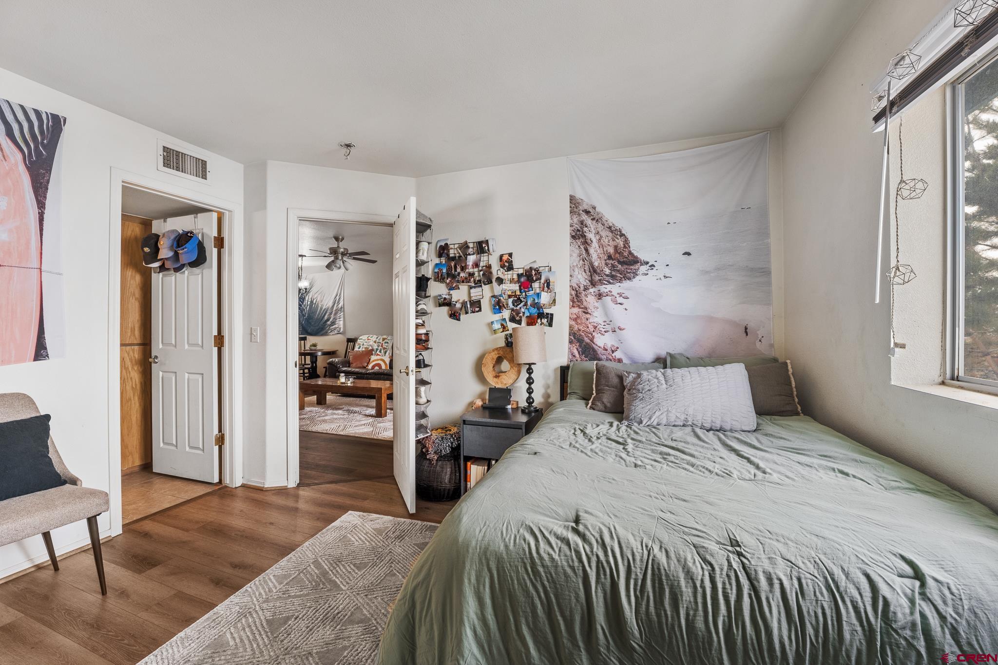 1100 Goeglein Gulch Road, Unit 206 Durango, CO 81301 - Photo 10 of 29 a bedroom with a bed and a couch